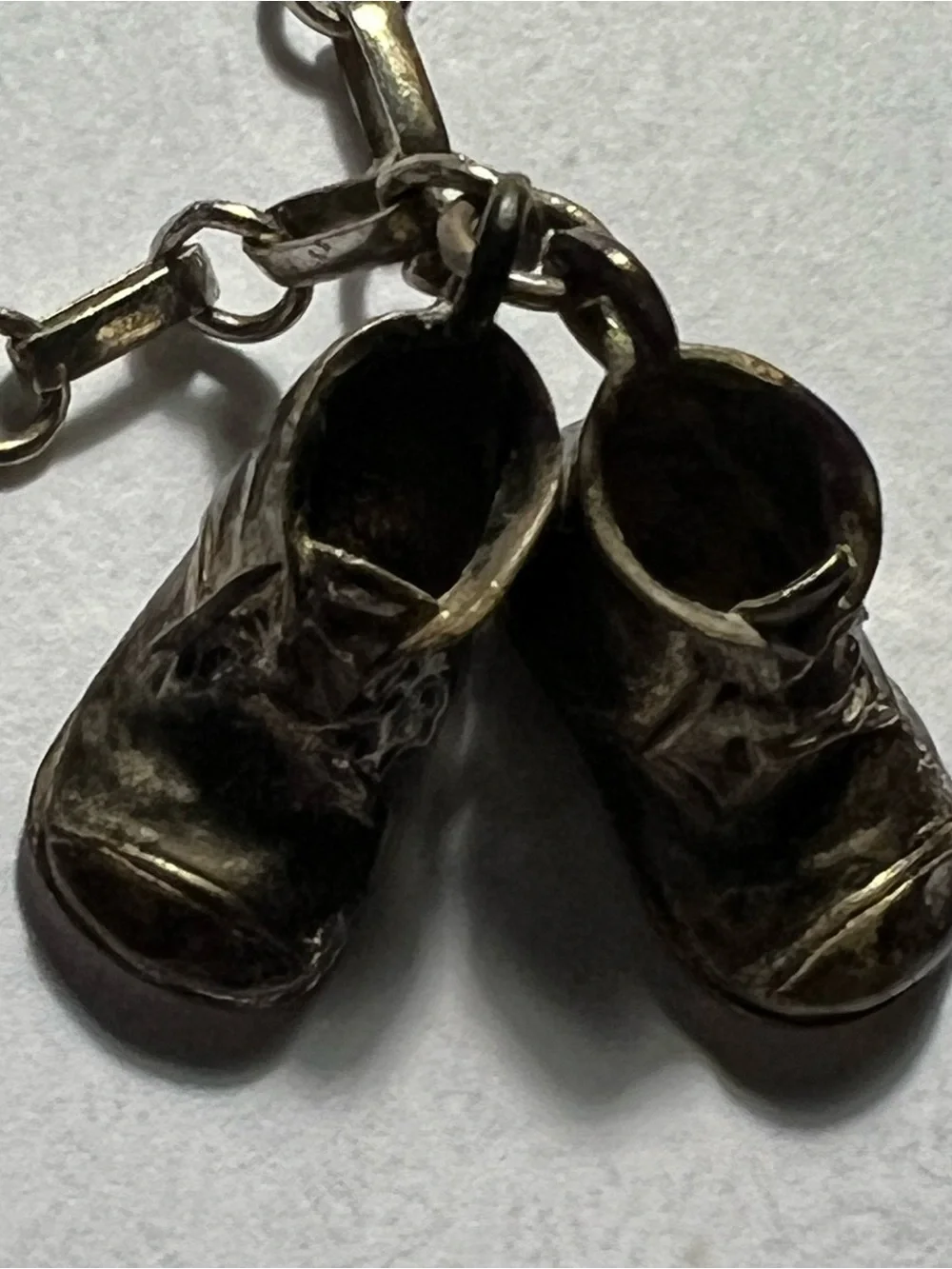 Sterling Silver charm bracelet with silver baby shoes charms